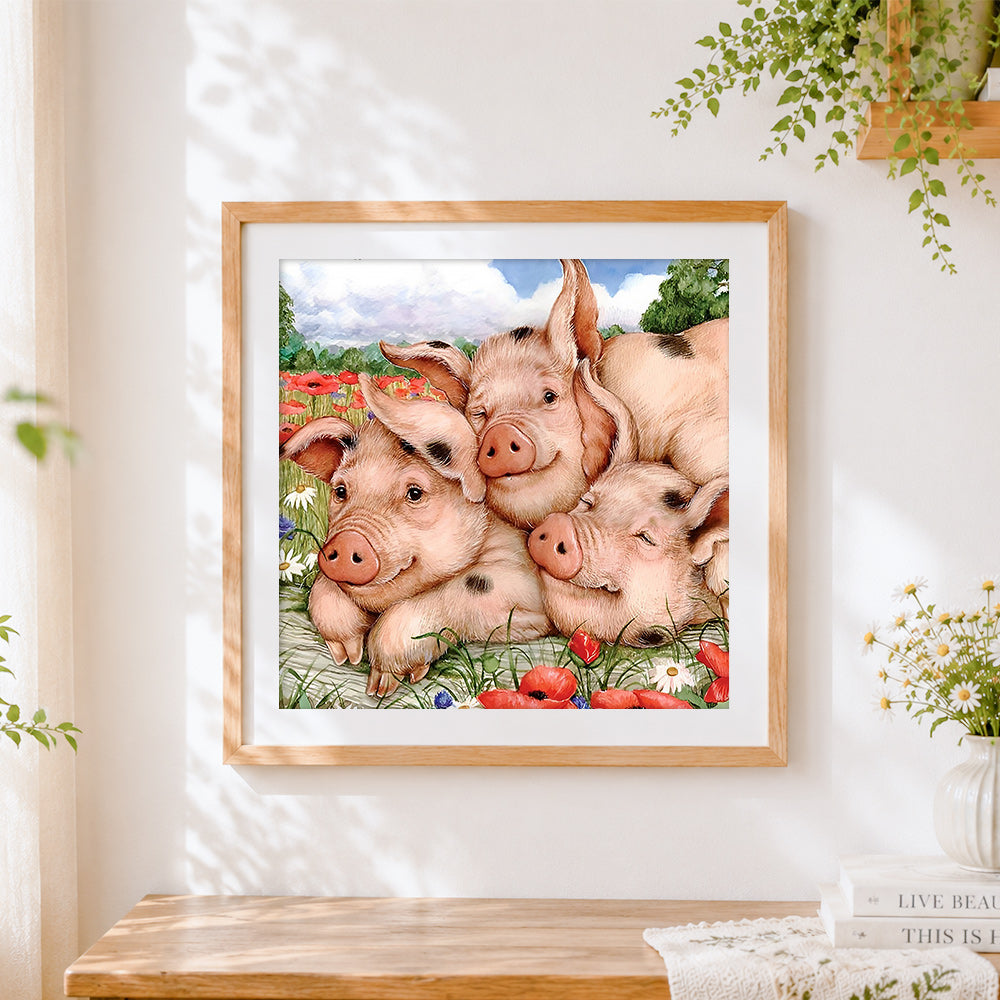 Finished three sleeping pigs in flowers cross stitch artwork displayed