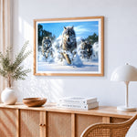 Three wolves running in snow cross stitch artwork displayed on wall as home decor