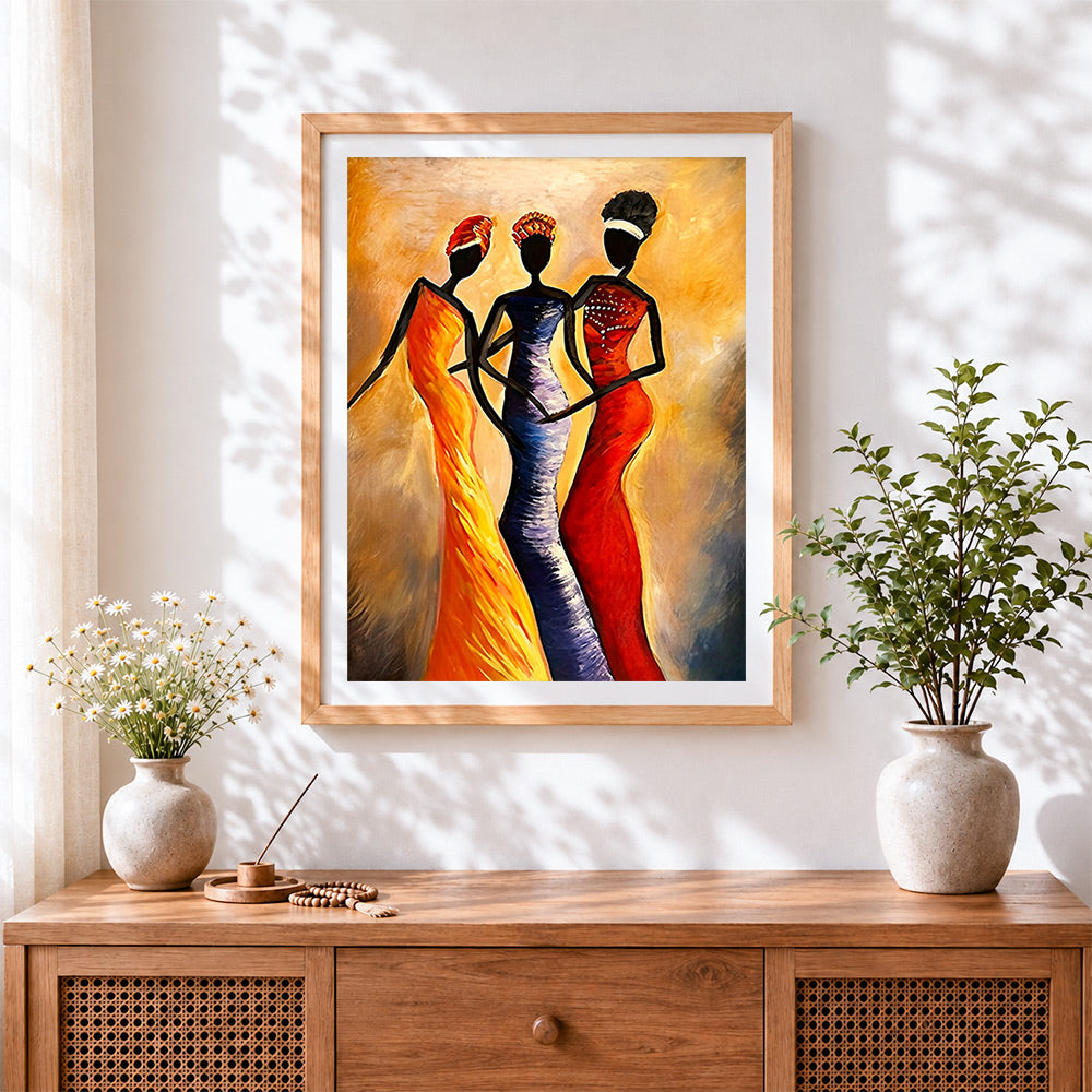 Finished three women in colourful dresses cross stitch artwork displayed
