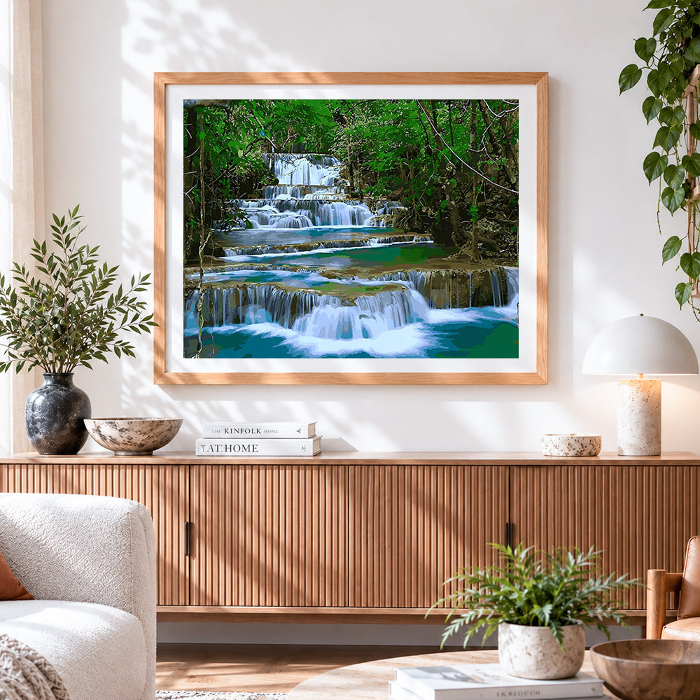 Finished tiered waterfall in a lush forest cross stitch artwork displayed