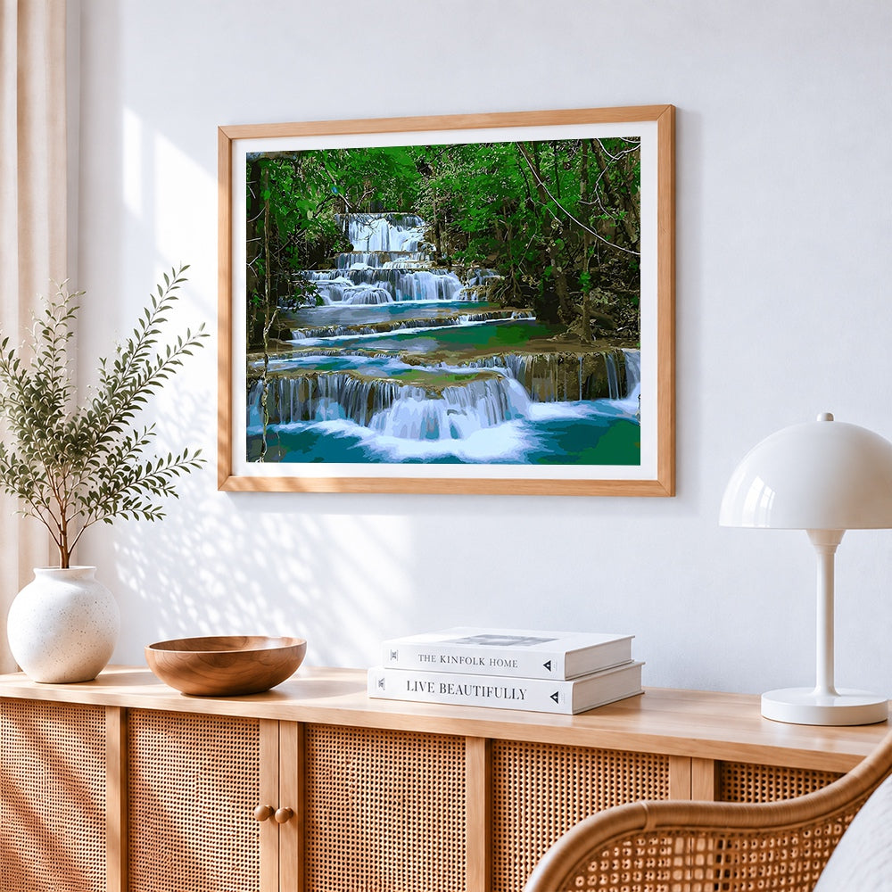 Tiered waterfall in a lush forest paint by numbers artwork displayed on wall as home decor