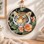 Tiger and peach blossoms embroidery hoop wall art displayed as warm and cosy handmade home decor