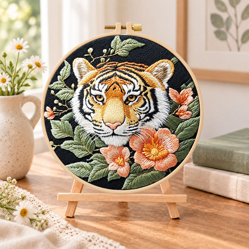 Tiger and peach blossoms embroidery kit finished hoop displayed on a wooden stand as cosy tabletop decor
