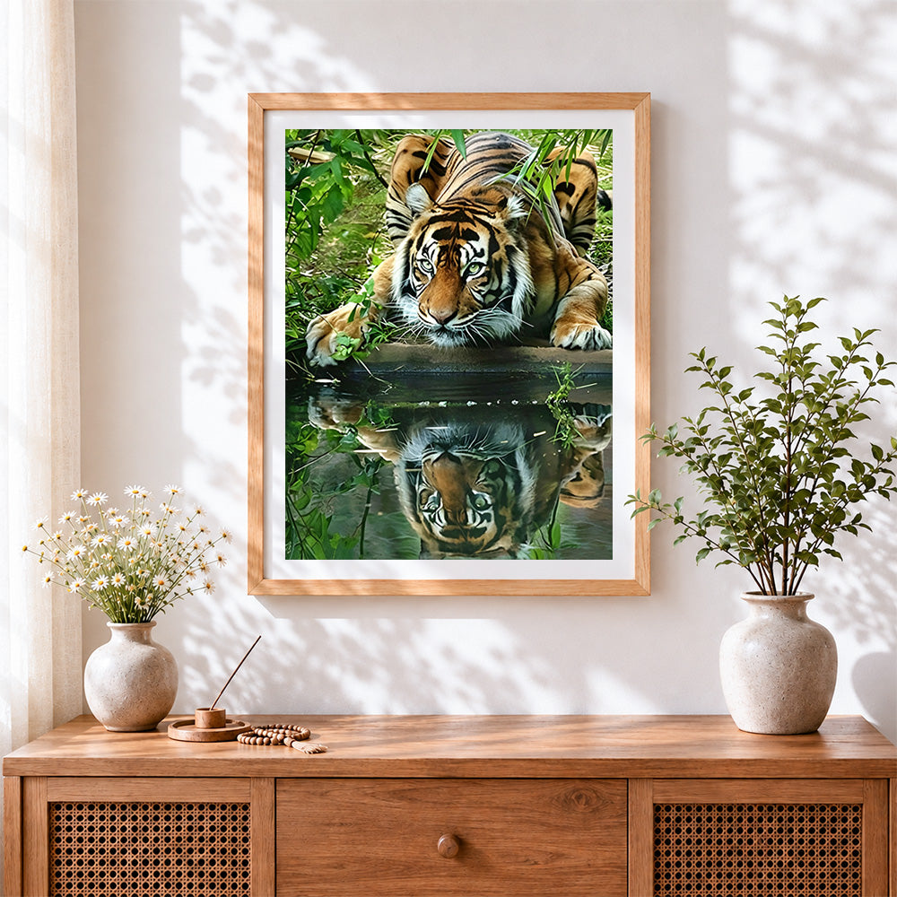 Finished tiger drinking water reflection cross stitch artwork displayed