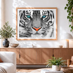 Finished tiger face close-up cross stitch artwork displayed