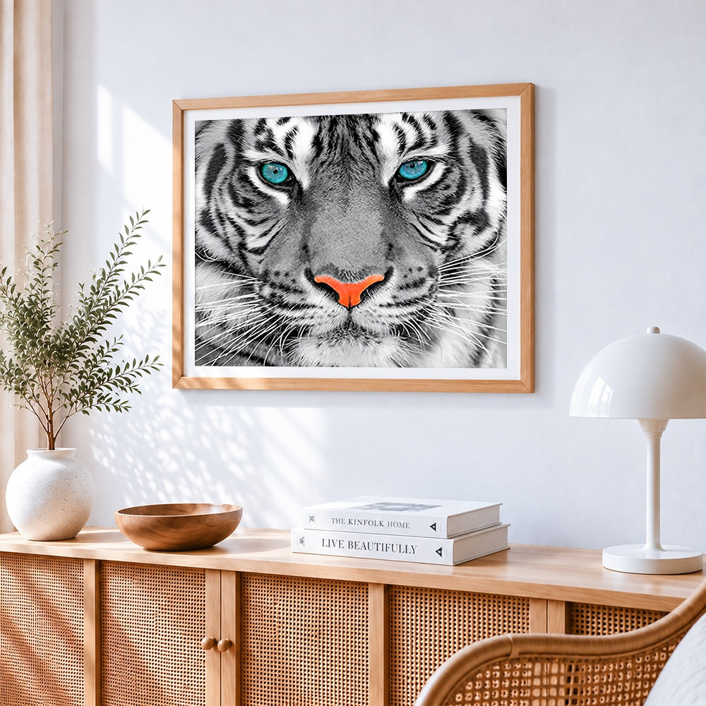Tiger face close-up cross stitch artwork displayed on wall as home decor