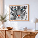 Tiger face close-up cross stitch artwork displayed on wall as home decor