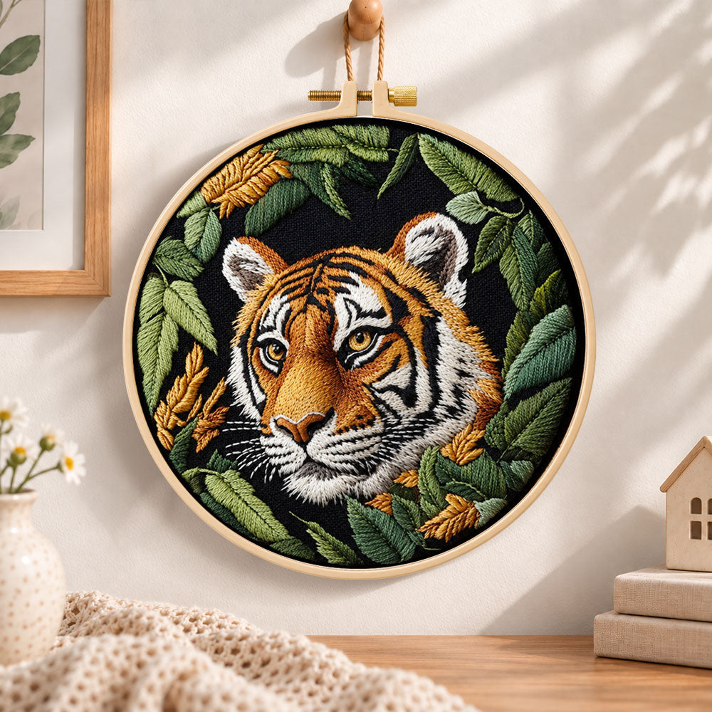 Tiger in dark foliage embroidery hoop wall art displayed as warm and cosy handmade home decor