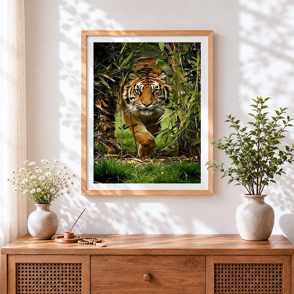 Finished tiger stalking in bamboo forest cross stitch artwork displayed
