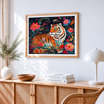Tiger surrounded by colourful flowers cross stitch artwork displayed on wall as home decor