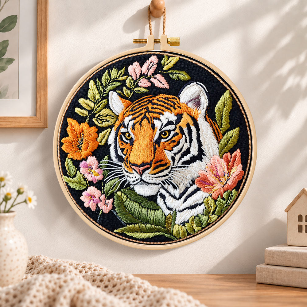 Tiger with wild blooms embroidery hoop wall art displayed as warm and cosy handmade home decor