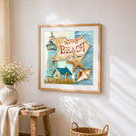 "To the beach" coastal sign cross stitch artwork displayed on wall as home decor