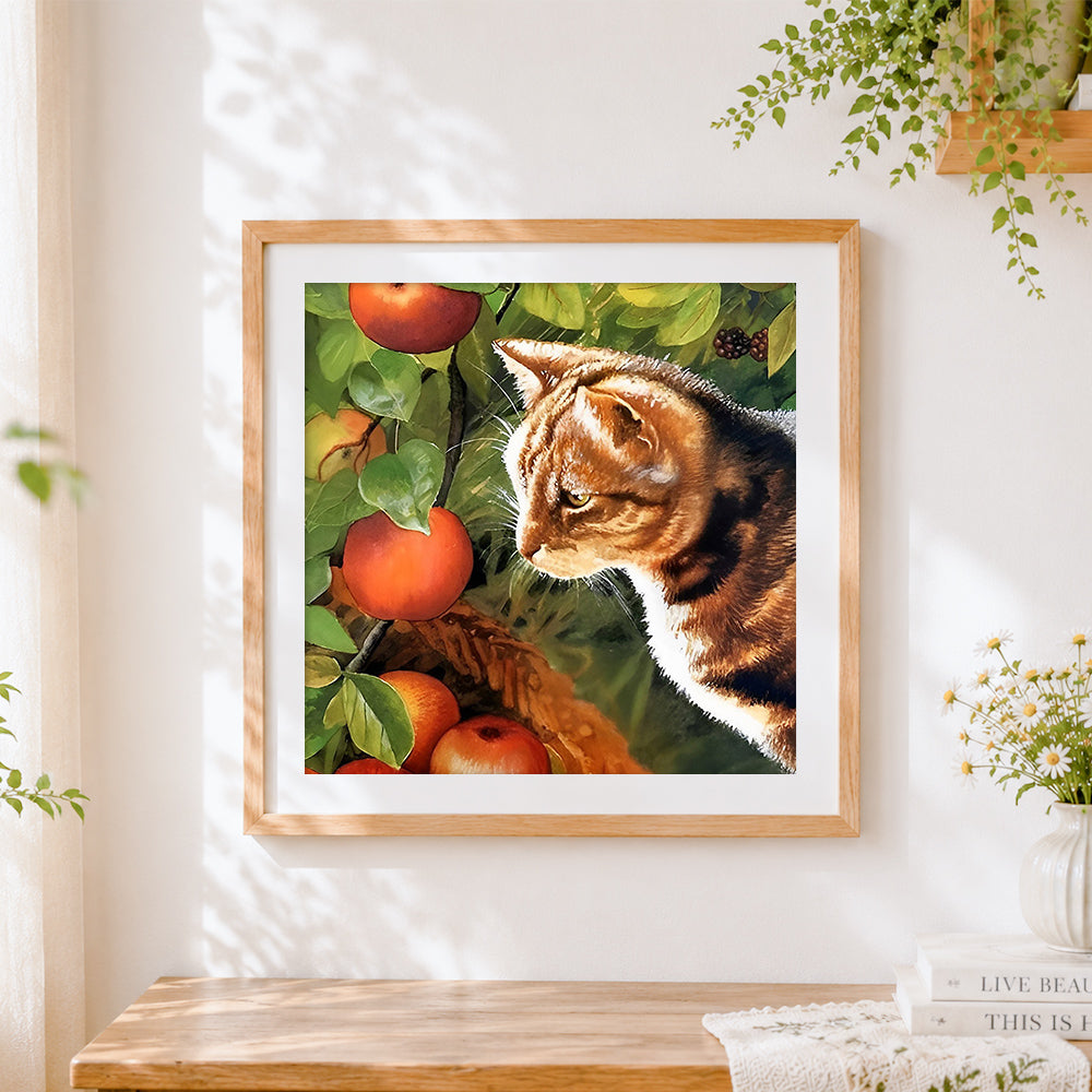 Finished tortoiseshell cat in apple orchard cross stitch artwork displayed