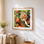 Tortoiseshell cat in apple orchard cross stitch artwork displayed on wall as home decor