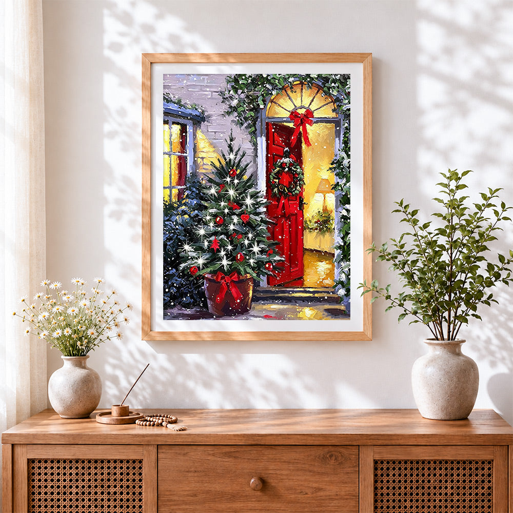 Finished traditional red door and christmas tree cross stitch artwork displayed