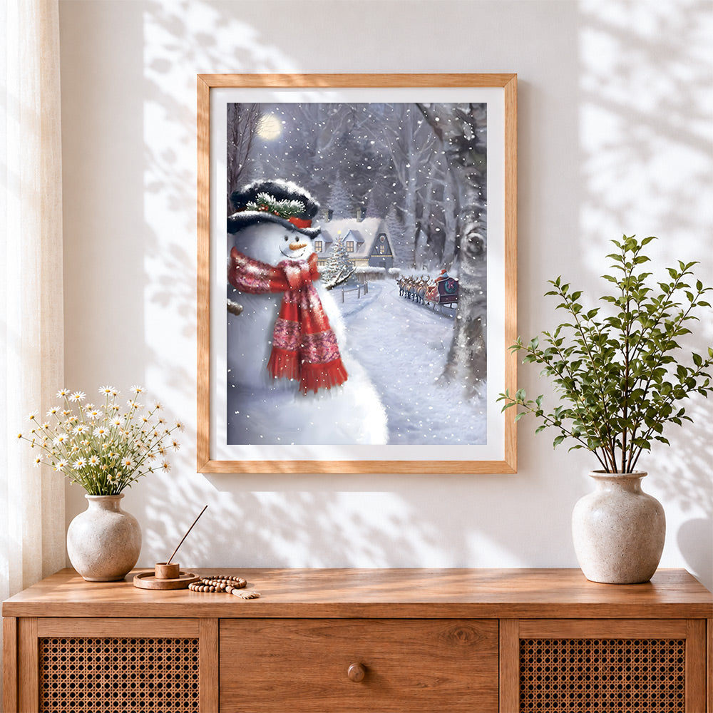 Finished traditional snowman and santa's sleigh cross stitch artwork displayed