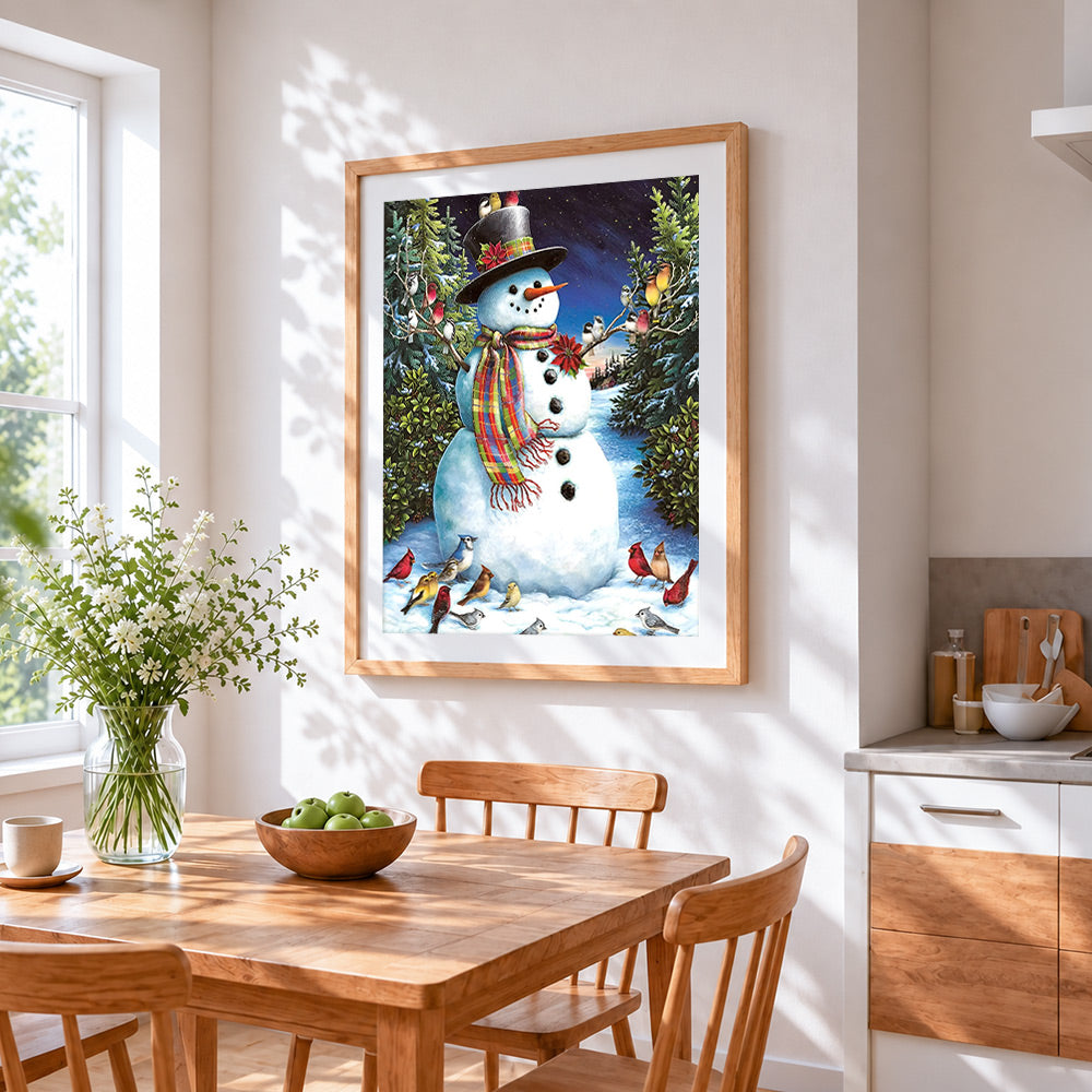 Traditional snowman and winter birds cross stitch artwork displayed on wall as home decor