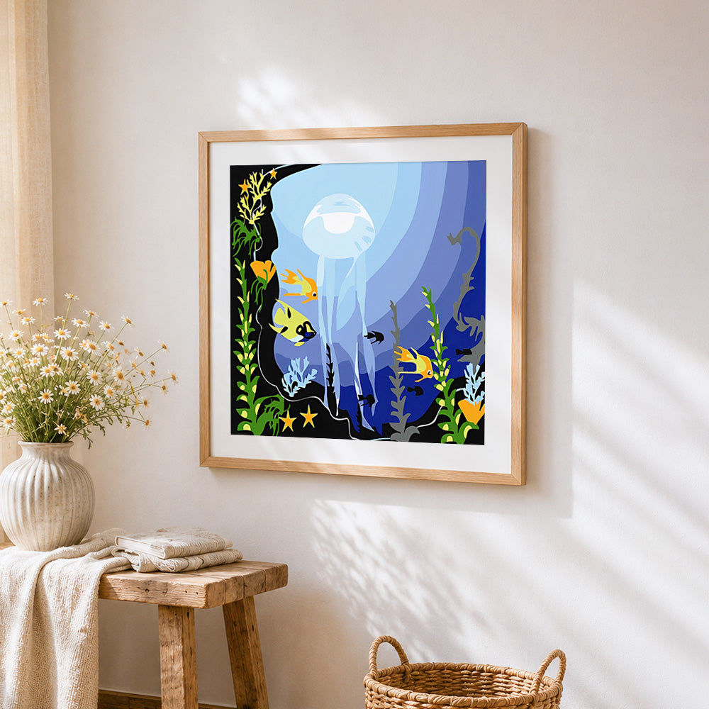 Transparent jellyfish and tropical fish cross stitch artwork displayed on wall as home decor
