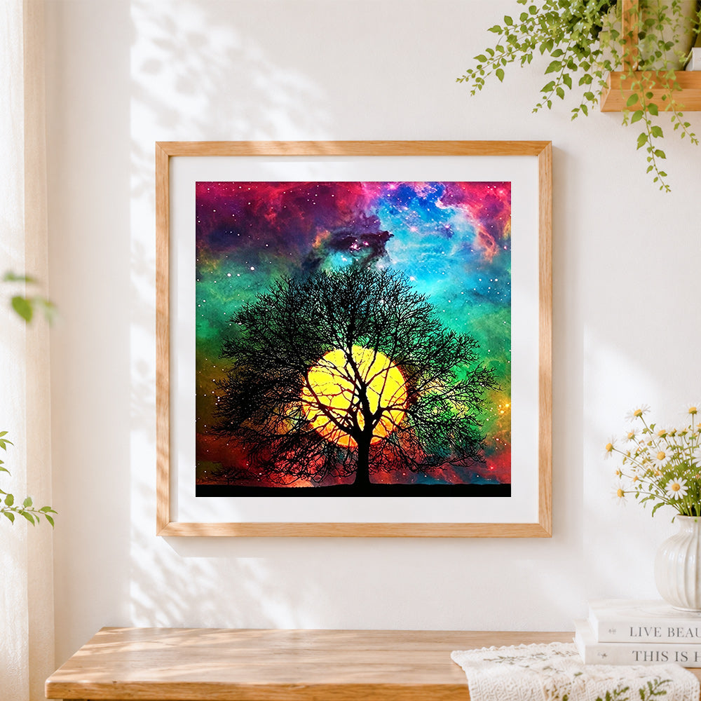Finished tree silhouette on colourful nebula cross stitch artwork displayed