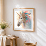 Tribal feather unicorn cross stitch artwork displayed on wall as home decor