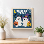 Finished trick or treat ghost friends artwork displayed on a wall