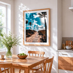 Tropical beach boardwalk cross stitch artwork displayed on wall as home decor