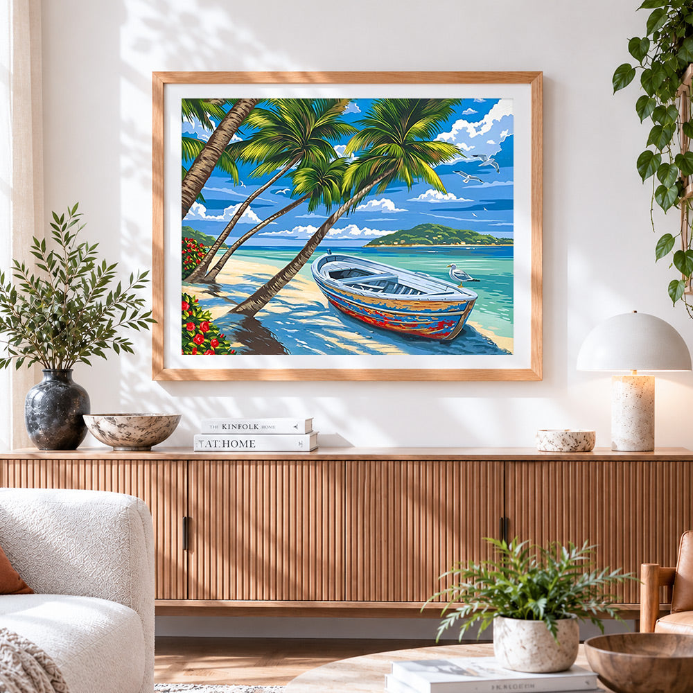 Finished tropical beach with boat and palm trees cross stitch artwork displayed