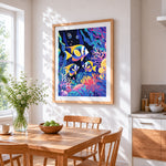 Tropical fish in a coral reef cross stitch artwork displayed on wall as home decor
