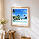 Tropical lagoon resort cross stitch artwork displayed on wall as home decor