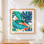Finished tropical monstera leaves pattern cross stitch artwork displayed