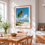 Tropical palm trees and pink sand beach cross stitch artwork displayed on wall as home decor