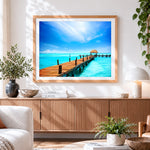 Finished tropical pier with thatched hut cross stitch artwork displayed