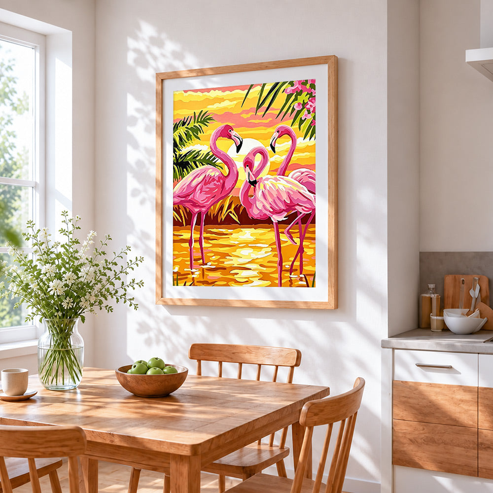 Tropical pink flamingos at sunset cross stitch artwork displayed on wall as home decor