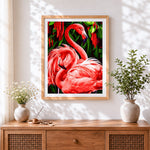 Finished tropical pink flamingos cross stitch artwork displayed