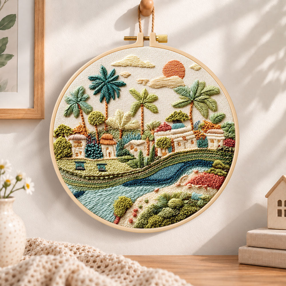 Tropical riverside hamlet embroidery hoop wall art displayed as warm and cosy handmade home decor