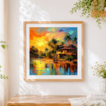 Finished tropical sunset over a waterfront cabin cross stitch artwork displayed