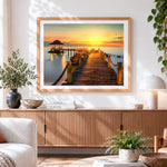 Finished tropical sunset pier and gazebo cross stitch artwork displayed