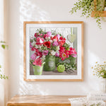 Finished tulips in a green jug cross stitch artwork displayed