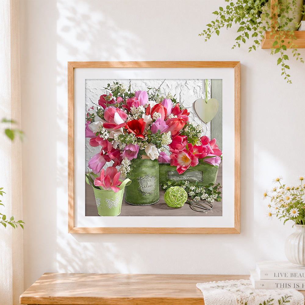 Finished tulips in a green jug cross stitch artwork displayed
