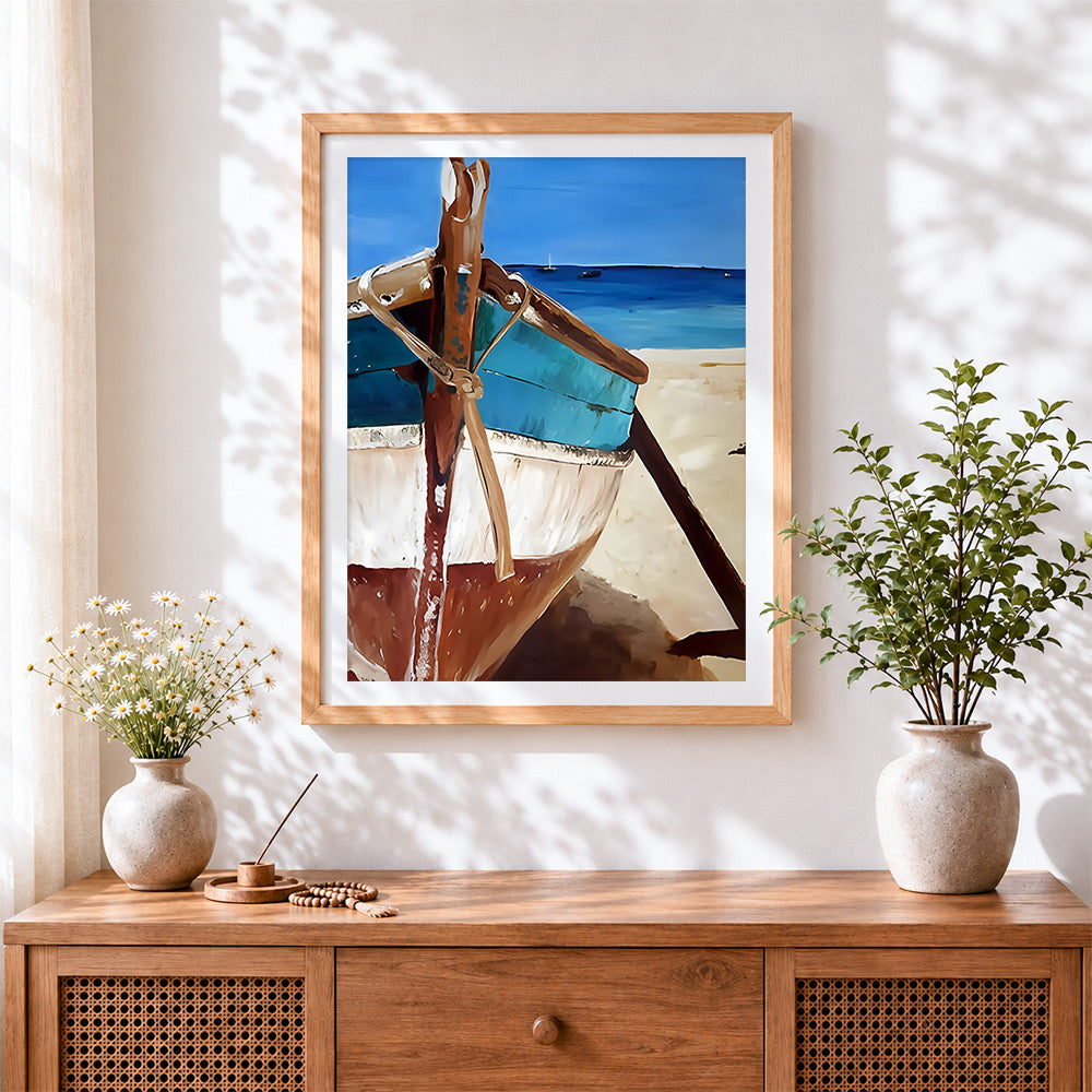 Finished turquoise boat on beach cross stitch artwork displayed