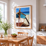 Turquoise boat on beach cross stitch artwork displayed on wall as home decor