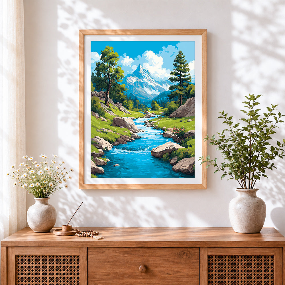 Finished turquoise mountain stream cross stitch artwork displayed