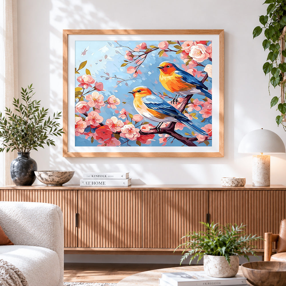 Finished two birds on a cherry blossom branch cross stitch artwork displayed