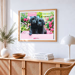 Two black labrador puppies in pink box cross stitch artwork displayed on wall as home decor