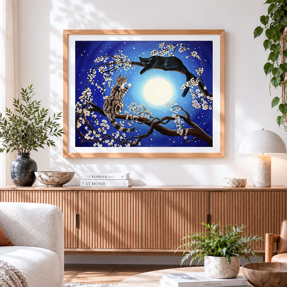 Finished two cats in a blossom tree cross stitch artwork displayed