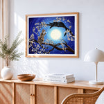 Two cats in a blossom tree cross stitch artwork displayed on wall as home decor
