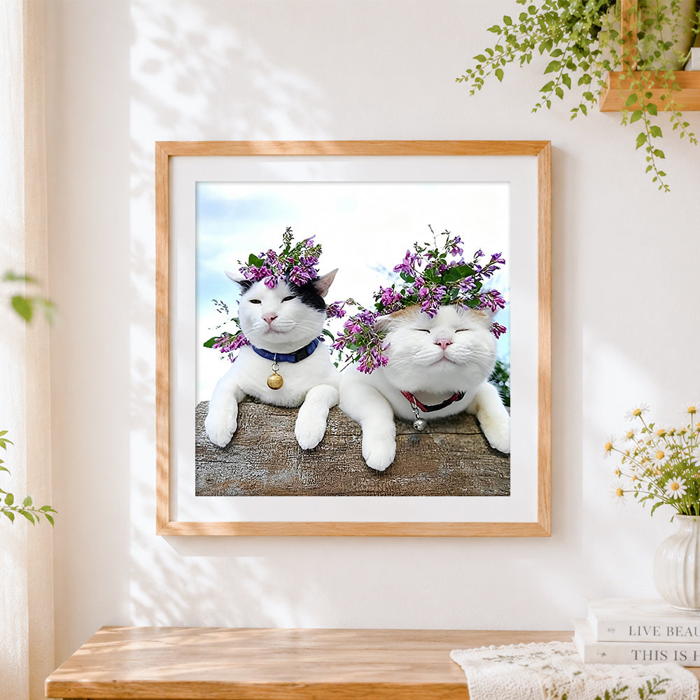 Finished two cats with flower crowns cross stitch artwork displayed
