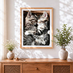 Finished two cuddling tabby kittens cross stitch artwork displayed