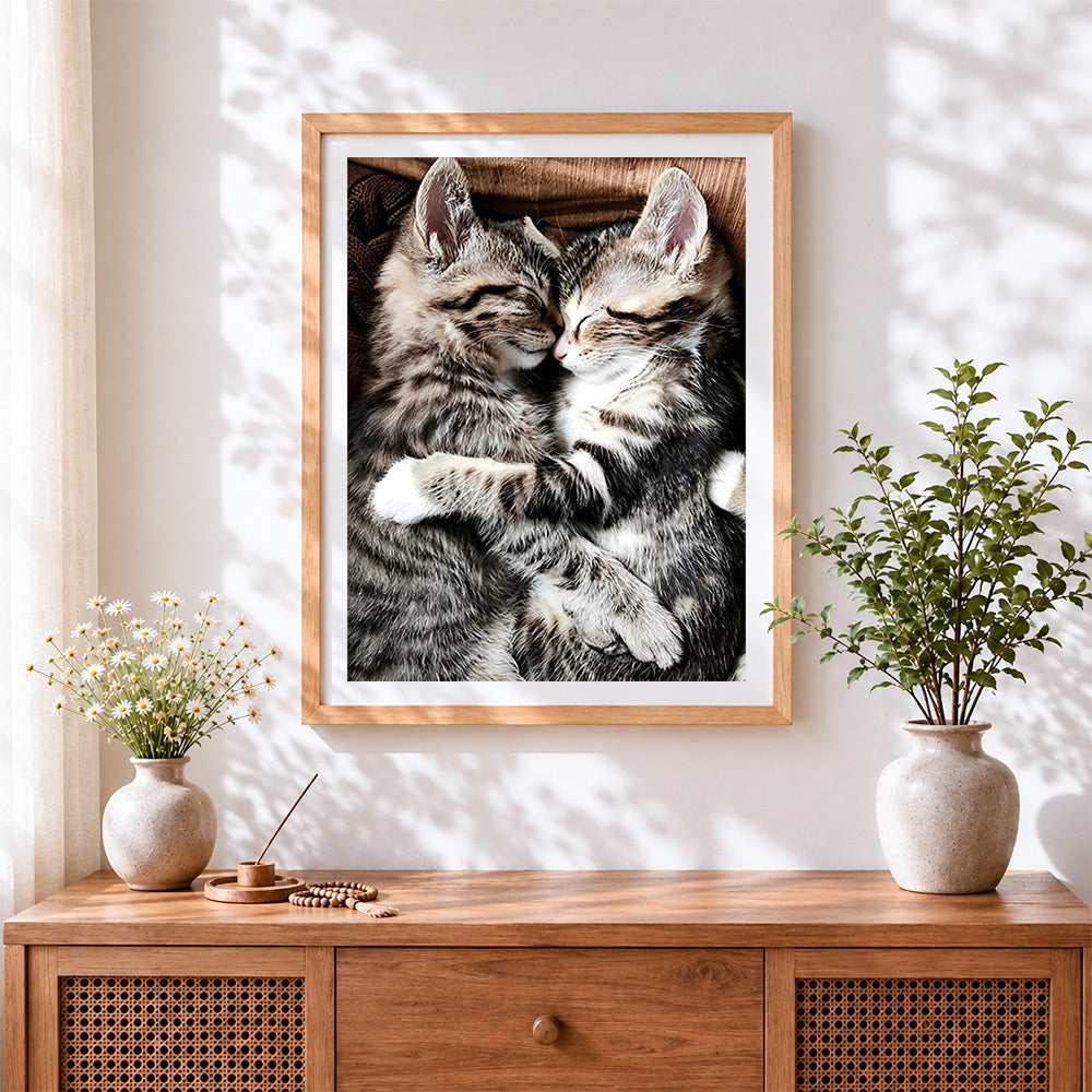 Finished two cuddling tabby kittens cross stitch artwork displayed