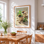 Two cups of coffee with mint and sugar cross stitch artwork displayed on wall as home decor